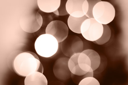 Blurred lights brown, mocha mousse background. Abstract bokeh with soft light. Demonstrating color, trend 2025 year.の写真素材