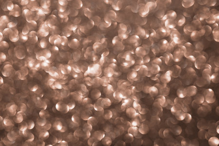 Mocha Mousse, brown sparkling glitter bokeh background, abstract defocused texture. Holiday lights. Demonstrating color, trend 2025 year.の写真素材
