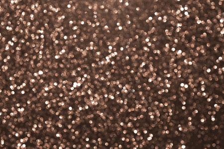 Mocha Mousse, brown sparkling glitter bokeh background, abstract defocused texture. Holiday lights. Demonstrating color, trend 2025 year.の写真素材