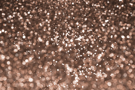 Mocha Mousse, brown sparkling glitter bokeh background, abstract defocused texture. Holiday lights. Demonstrating color, trend 2025 year.の写真素材