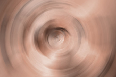 Blurred radial gradient brown, mocha mousse background. Mixed circular texture. Demonstrating color, trend 2025 year.の写真素材