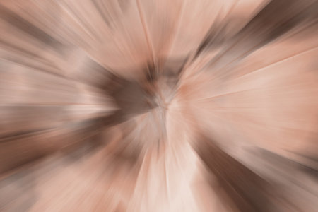 Blurred lights dark brown, mocha mousse background. Abstract soft explosion effect. Centric motion pattern. Demonstrating color, trend 2025 year.の写真素材