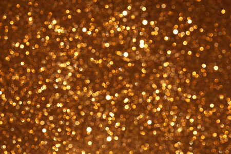 Golden glitter festive bokeh background, abstract defocused texture. Holiday lightsの写真素材