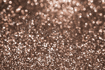 Mocha Mousse, brown sparkling glitter bokeh background, abstract defocused texture. Holiday lights. Demonstrating color, trend 2025 year.の写真素材