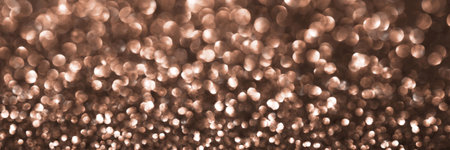Mocha Mousse, brown sparkling glitter bokeh background banner, abstract defocused texture header. Holiday lights. Demonstrating color, trend 2025 year.の写真素材