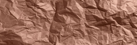 Brown, mocha mousse crumpled, wrinkled recycle craft paper texture background banner.の写真素材
