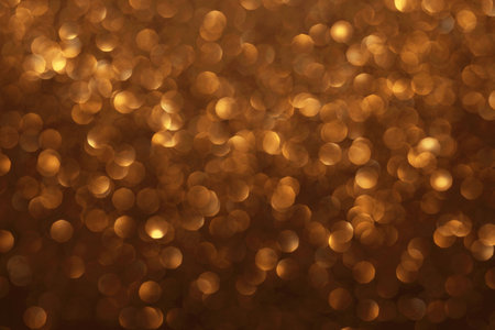 Golden glitter festive bokeh background, abstract defocused texture. Holiday lightsの写真素材