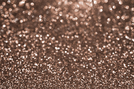 Mocha Mousse, brown sparkling glitter bokeh background, abstract defocused texture. Holiday lights. Demonstrating color, trend 2025 year.の写真素材
