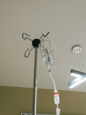 IV infusion pole with saline bag, medical equipment, hospital environment.の写真素材