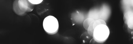 Blurred lights black and white background, banner texture. Abstract bokeh with soft light header. Wide screen wallpaper. Panoramic web banner with copy space for designの写真素材