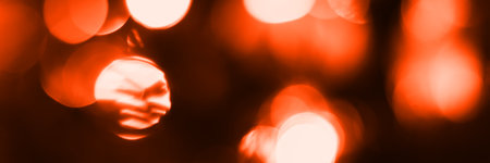 Blurred lights, dark orange background, banner texture. Abstract bokeh with soft light header. Wide screen wallpaper. Panoramic web banner with copy space for designの写真素材