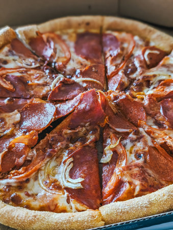 Pepperoni pizza slices arranged in circular pattern, cheese melting, crust visible.の写真素材