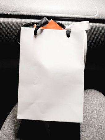 Blank white shopping bag with black handles.の写真素材