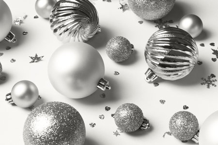 Cloud white Christmas card with silver balls and confetti, abstract holiday background. Demonstrating color, trend.の写真素材