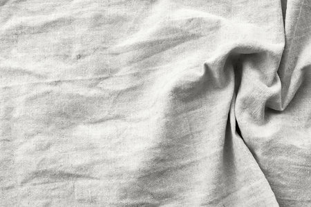 Natural cloud white linen fabric texture. Rough crumpled burlap background. Demonstrating color, trend.の写真素材