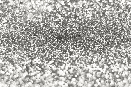 Silver cloud white dancer sparkling glitter bokeh background, abstract defocused texture. Holiday...