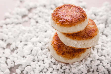 Cheesecakes, cottage cheese on a wood background . Picture taken in the studio