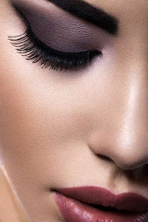 Beautiful brunette girl with arabic evening make-up and perfect skin. Beauty face. Close up.の写真素材