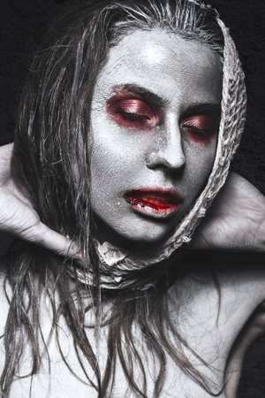 Girl in the form of zombies, Halloween corpse with blood on his lips. Image for a horror film....