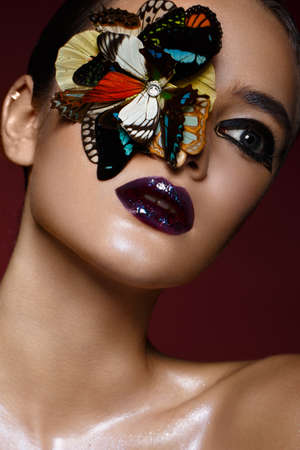 Beautiful girl with bright creative make-up and graphic arrows. Beauty face. Photos shot in studioの写真素材