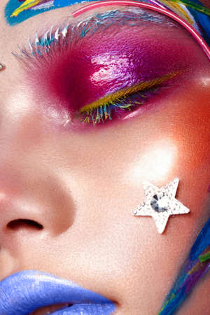 Beautiful girl with creative make-up in pop art style. Beauty face. Photo taken in studio
