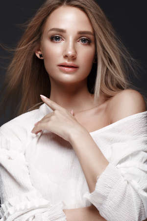 Beautiful woman with evening make-up and long straight hair . Smoky eyes. Fashion photo. Picture...