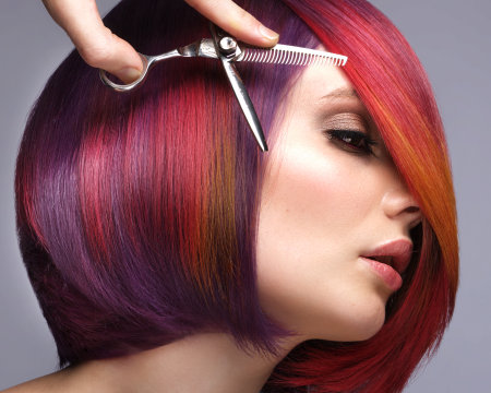 Beautiful woman with multi-colored hair and creative make up and hairstyle. Beauty face.の写真素材