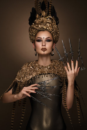 Beautiful girl with art fashion make up, creative hairstyle, long nails. Design manicure. Beauty face.の写真素材