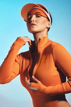 Beautiful attractive woman in a trendy swimsuit with sports equipment and accessories.の写真素材