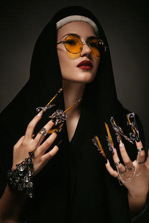 Beautiful woman with art makeup, creative long nails. Design manicure. Beauty face.の写真素材