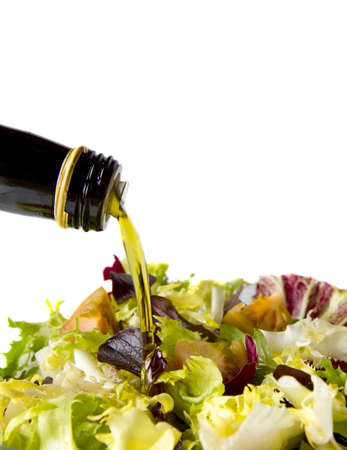 mixed salad lettuce to a jet falling olive oilの写真素材