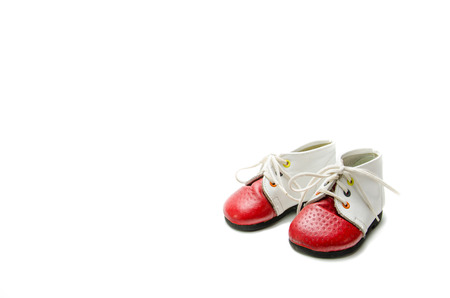 Baby booties on a white background.の写真素材