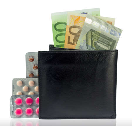 wallet with money and several varieties pillsの写真素材