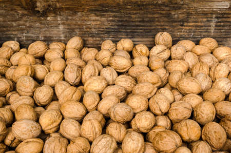 Walnuts wooden background