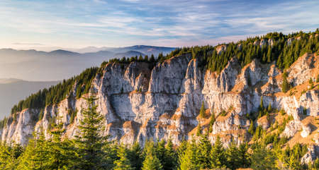Peaks of mountains illuminated by the sun