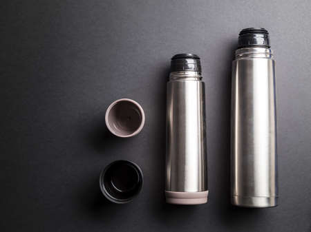 Flask organized over black background with copy space for text or other above viewの写真素材