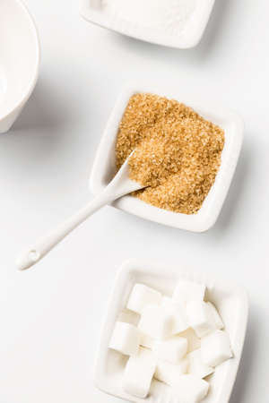 Brown sugar and white in the white bowlsの写真素材