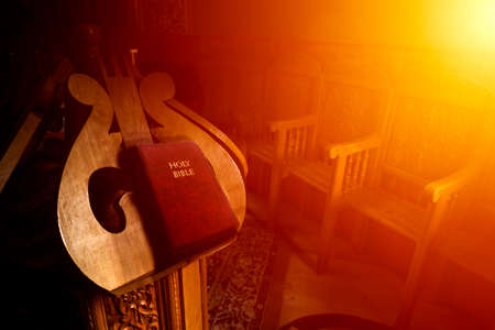 The idyllic atmosphere in the church with the Bible on a book stand.の写真素材