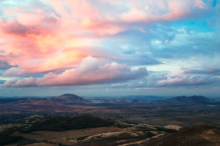Mountains landscape with spectacular sky on a autumn morning dayの写真素材