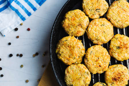 Meatballs made from chicken and vegetables roasted over grill. Meatball with chicken and carrot,...