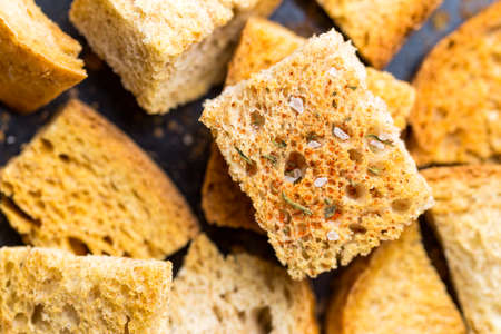 Crispy croutons with spices. Macro shot of roasted croutonの写真素材