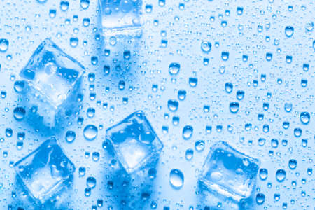 Melted ice cubes with dropsの写真素材