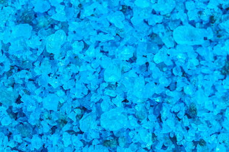 Blue salt background, high detailed background from blue sea salt, top view