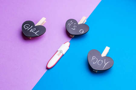 Its a Boy or girl concept. Pregnancy test over pink and blue backgroundの写真素材