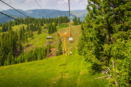 Chairlift route from Vatra Dornei, Romania, passing through montainsの写真素材