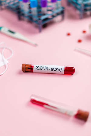Blood tube contaminated with coronavirus in the medical analysis laboratory. Place for text