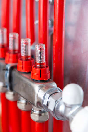Pipelines in main control manifold of house heating system. Distributor of central heating.