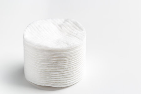 Cotton pads stack on gray backgroundの写真素材