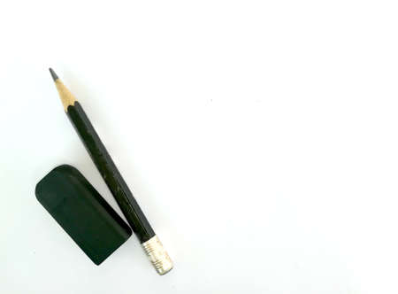 Top view of pencil and eraser on white paperの写真素材
