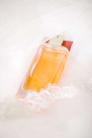 Perfume bottle on lacy tulle. Wedding Day.の写真素材
